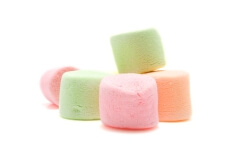 Stacked colorful marshmallows isolated on white background